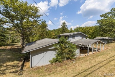 Unique and full of charm, this home sits on four lots totaling 2 on Terre Du Lac Golf and Country Club in Missouri - for sale on GolfHomes.com, golf home, golf lot