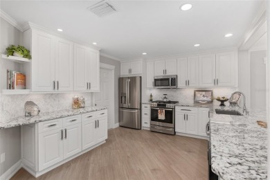 This CUSTOM Amelia courtyard villa, offering 2 Bedrooms and a on The Links of Spruce Creek in Florida - for sale on GolfHomes.com, golf home, golf lot