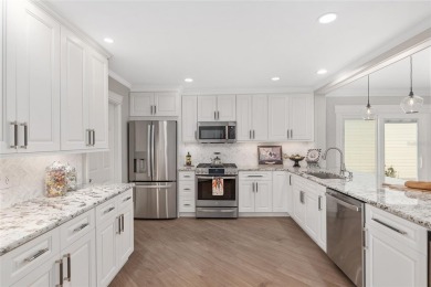 This CUSTOM Amelia courtyard villa, offering 2 Bedrooms and a on The Links of Spruce Creek in Florida - for sale on GolfHomes.com, golf home, golf lot