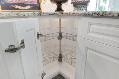 This CUSTOM Amelia courtyard villa, offering 2 Bedrooms and a on The Links of Spruce Creek in Florida - for sale on GolfHomes.com, golf home, golf lot