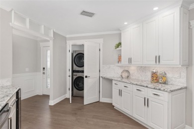 This CUSTOM Amelia courtyard villa, offering 2 Bedrooms and a on The Links of Spruce Creek in Florida - for sale on GolfHomes.com, golf home, golf lot