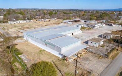 8.50+/- industrial-zoned acres with approximately 29,000 square on Cherokee Creek Golf Club in Arkansas - for sale on GolfHomes.com, golf home, golf lot