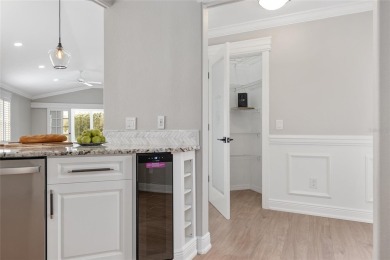 This CUSTOM Amelia courtyard villa, offering 2 Bedrooms and a on The Links of Spruce Creek in Florida - for sale on GolfHomes.com, golf home, golf lot