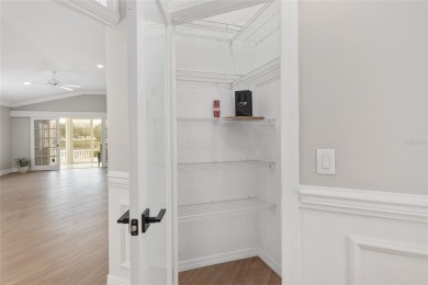 This CUSTOM Amelia courtyard villa, offering 2 Bedrooms and a on The Links of Spruce Creek in Florida - for sale on GolfHomes.com, golf home, golf lot