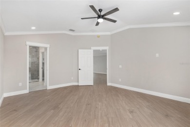 This CUSTOM Amelia courtyard villa, offering 2 Bedrooms and a on The Links of Spruce Creek in Florida - for sale on GolfHomes.com, golf home, golf lot