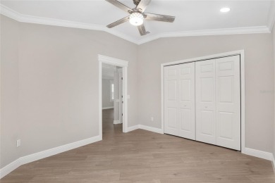 This CUSTOM Amelia courtyard villa, offering 2 Bedrooms and a on The Links of Spruce Creek in Florida - for sale on GolfHomes.com, golf home, golf lot