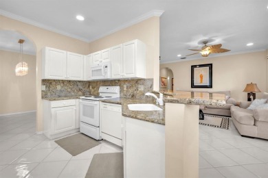 WAKE UP TO SERENE GARDEN VIEWS & INDULGE IN RESORT STYLE on TPC Eagle Trace in Florida - for sale on GolfHomes.com, golf home, golf lot