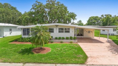 Welcome to this beautifully maintained 2-bedroom, 2-bathroom on Zellwood Station Country Club in Florida - for sale on GolfHomes.com, golf home, golf lot