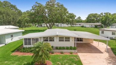 Welcome to this beautifully maintained 2-bedroom, 2-bathroom on Zellwood Station Country Club in Florida - for sale on GolfHomes.com, golf home, golf lot