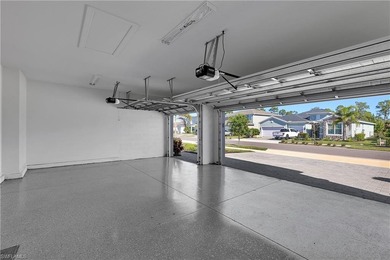 NEED A 3-CAR GARAGE? This contemporary lake view home has 4 on Babcock National Golf Course in Florida - for sale on GolfHomes.com, golf home, golf lot