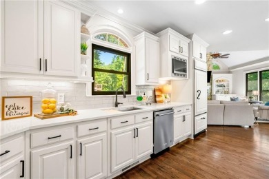 Experience resort-style living on over an acre in this stunning on Alpharetta Athletic Club East in Georgia - for sale on GolfHomes.com, golf home, golf lot