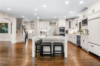 Experience resort-style living on over an acre in this stunning on Alpharetta Athletic Club East in Georgia - for sale on GolfHomes.com, golf home, golf lot