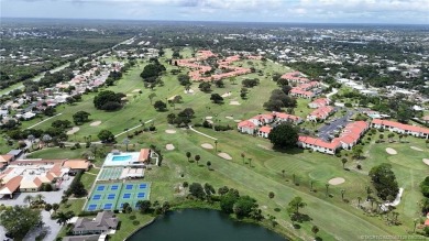 Peaceful and tranquil living comes to mind when you enter this on Miles Grant Country Club in Florida - for sale on GolfHomes.com, golf home, golf lot