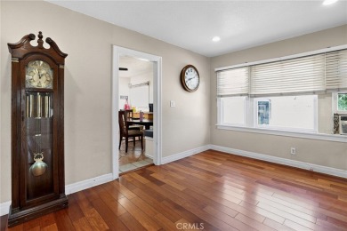 Discover this Spanish-style fixer located on a desirable corner on Mile Square Golf Course in California - for sale on GolfHomes.com, golf home, golf lot