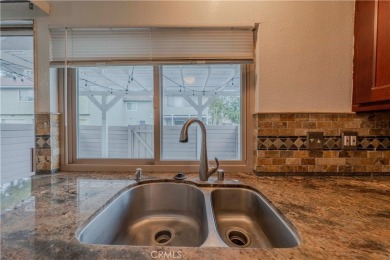 Don't miss this stunning 3-bedroom, 2.5-bath end-unit condo in on Anaheim Hills Golf Course in California - for sale on GolfHomes.com, golf home, golf lot