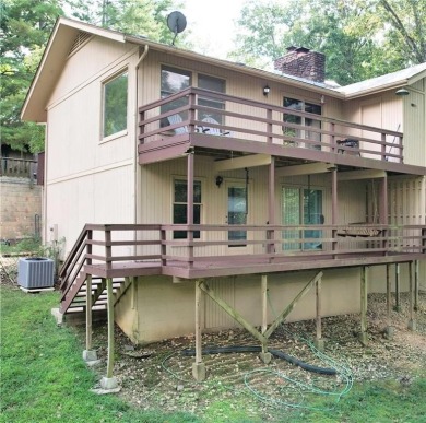 Discover the charm of Bella Vista living in this inviting on Bella Vista Country Club and Golf Course in Arkansas - for sale on GolfHomes.com, golf home, golf lot