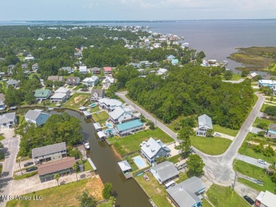 Welcome to your dream home on the water, where every detail has on Pass Christian Isles Golf Club in Mississippi - for sale on GolfHomes.com, golf home, golf lot