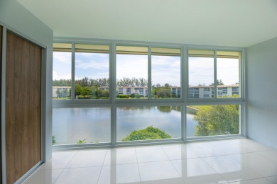 Serenity with sophisticated upgrades and timeless elegance, this on Wynmoor Golf Course in Florida - for sale on GolfHomes.com, golf home, golf lot