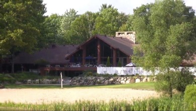 Spacious executive home on the beautiful Pines Golf Course in on Michaywe Pines Course in Michigan - for sale on GolfHomes.com, golf home, golf lot