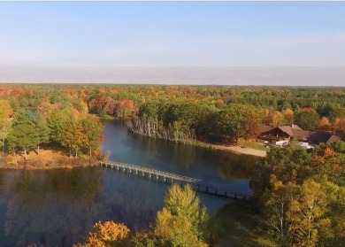 Spacious executive home on the beautiful Pines Golf Course in on Michaywe Pines Course in Michigan - for sale on GolfHomes.com, golf home, golf lot