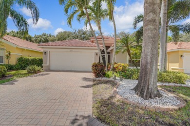 RARELY AVAILABLE EXTENDED GENOVA MODEL SET ON A BEAUTIFUL CANAL on Westchester Golf and Country Club in Florida - for sale on GolfHomes.com, golf home, golf lot