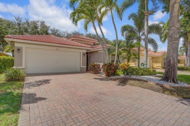 RARELY AVAILABLE EXTENDED GENOVA MODEL SET ON A BEAUTIFUL CANAL on Westchester Golf and Country Club in Florida - for sale on GolfHomes.com, golf home, golf lot