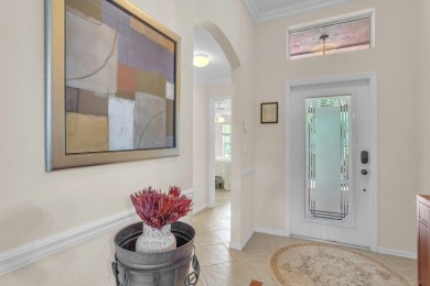 RARELY AVAILABLE EXTENDED GENOVA MODEL SET ON A BEAUTIFUL CANAL on Westchester Golf and Country Club in Florida - for sale on GolfHomes.com, golf home, golf lot