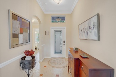 RARELY AVAILABLE EXTENDED GENOVA MODEL SET ON A BEAUTIFUL CANAL on Westchester Golf and Country Club in Florida - for sale on GolfHomes.com, golf home, golf lot
