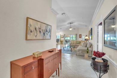 RARELY AVAILABLE EXTENDED GENOVA MODEL SET ON A BEAUTIFUL CANAL on Westchester Golf and Country Club in Florida - for sale on GolfHomes.com, golf home, golf lot