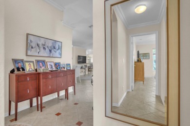 RARELY AVAILABLE EXTENDED GENOVA MODEL SET ON A BEAUTIFUL CANAL on Westchester Golf and Country Club in Florida - for sale on GolfHomes.com, golf home, golf lot