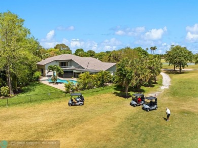 Spectacular golf course views from this unique custom built on Country Club of Coral Springs in Florida - for sale on GolfHomes.com, golf home, golf lot