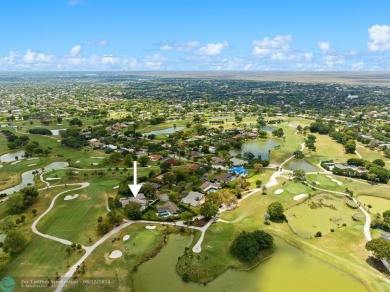 Spectacular golf course views from this unique custom built on Country Club of Coral Springs in Florida - for sale on GolfHomes.com, golf home, golf lot