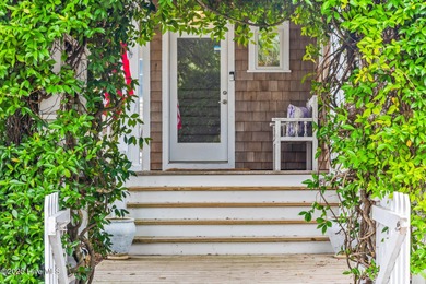 Coastal charm on one of the island's most iconic corners. At the on Bald Head Island Golf Club in North Carolina - for sale on GolfHomes.com, golf home, golf lot