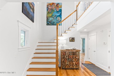 Coastal charm on one of the island's most iconic corners. At the on Bald Head Island Golf Club in North Carolina - for sale on GolfHomes.com, golf home, golf lot