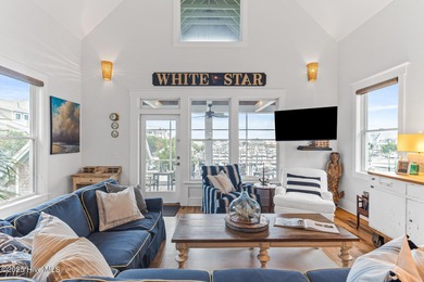 Coastal charm on one of the island's most iconic corners. At the on Bald Head Island Golf Club in North Carolina - for sale on GolfHomes.com, golf home, golf lot