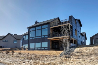 Situated on The Ranch Club golf course, this beautiful modern on The Ranch Club in Montana - for sale on GolfHomes.com, golf home, golf lot