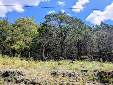 Ready to build your dream home? Quiet and gently wooded within a on Holiday Island Executive Golf Course in Arkansas - for sale on GolfHomes.com, golf home, golf lot