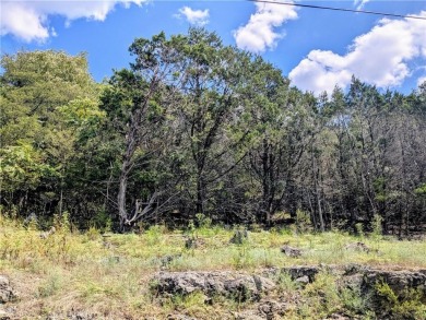 Ready to build your dream home? Quiet and gently wooded within a on Holiday Island Executive Golf Course in Arkansas - for sale on GolfHomes.com, golf home, golf lot