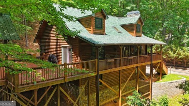 Welcome to this rare 4 bedroom, 3 1/2 bath LOG CABIN find in an on Bent Tree Golf Course in Georgia - for sale on GolfHomes.com, golf home, golf lot