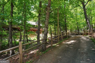 Welcome to this rare 4 bedroom, 3 1/2 bath LOG CABIN find in an on Bent Tree Golf Course in Georgia - for sale on GolfHomes.com, golf home, golf lot