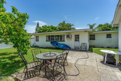 Living in paradise that is conveniently located to everything on New Smyrna Beach Golf Course in Florida - for sale on GolfHomes.com, golf home, golf lot