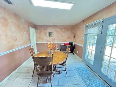 Centrally located this 4 bedroom 2 bath brick home offers on  in AL - for sale on GolfHomes.com, golf home, golf lot