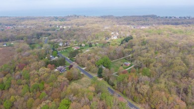 WOODED ONE ACRE Building Site offers an attractive canvas for on Whittaker Woods Golf Course in Michigan - for sale on GolfHomes.com, golf home, golf lot