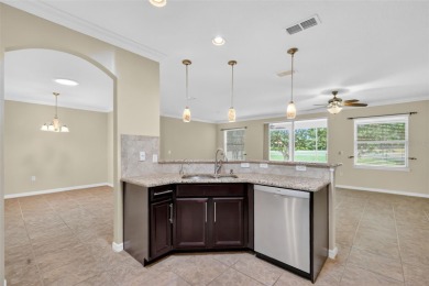 This 2 bed room 2 bath home with a den/study . Two solar lights on Arlington Ridge Golf Club in Florida - for sale on GolfHomes.com, golf home, golf lot