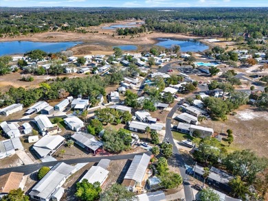 Discover the charm of Camp-A-Wyle, a highly desirable community on Glen Lakes Country Club in Florida - for sale on GolfHomes.com, golf home, golf lot