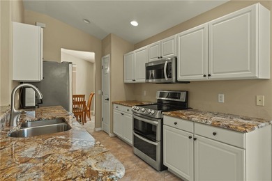 TWIN VILLA WITH HIGHLY DESIRABLE OPEN FLOOR PLAN AND MANY on Colonial Country Club in Florida - for sale on GolfHomes.com, golf home, golf lot