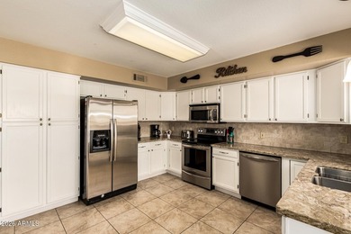 Located on a corner lot just a short walk from the lake in on Estrella Mountain Ranch Golf Course in Arizona - for sale on GolfHomes.com, golf home, golf lot