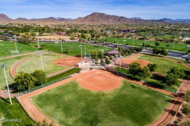 Nestled on a premium large lot adorned with lush landscaping on Anthem Golf and Country Club  in Arizona - for sale on GolfHomes.com, golf home, golf lot