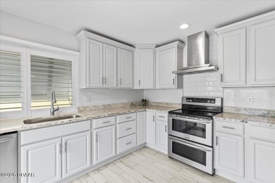 COASTAL LIVING with CHARACTER... Where MORNINGS START ON THE on Palm Harbor Golf Club in Florida - for sale on GolfHomes.com, golf home, golf lot