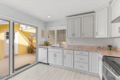 COASTAL LIVING with CHARACTER... Where MORNINGS START ON THE on Palm Harbor Golf Club in Florida - for sale on GolfHomes.com, golf home, golf lot